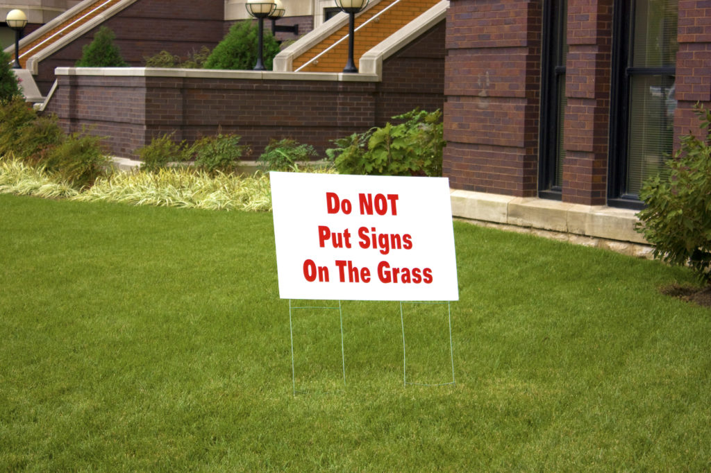 Do Not Put Signs on the Grass Sign - Jacobs Media Strategies